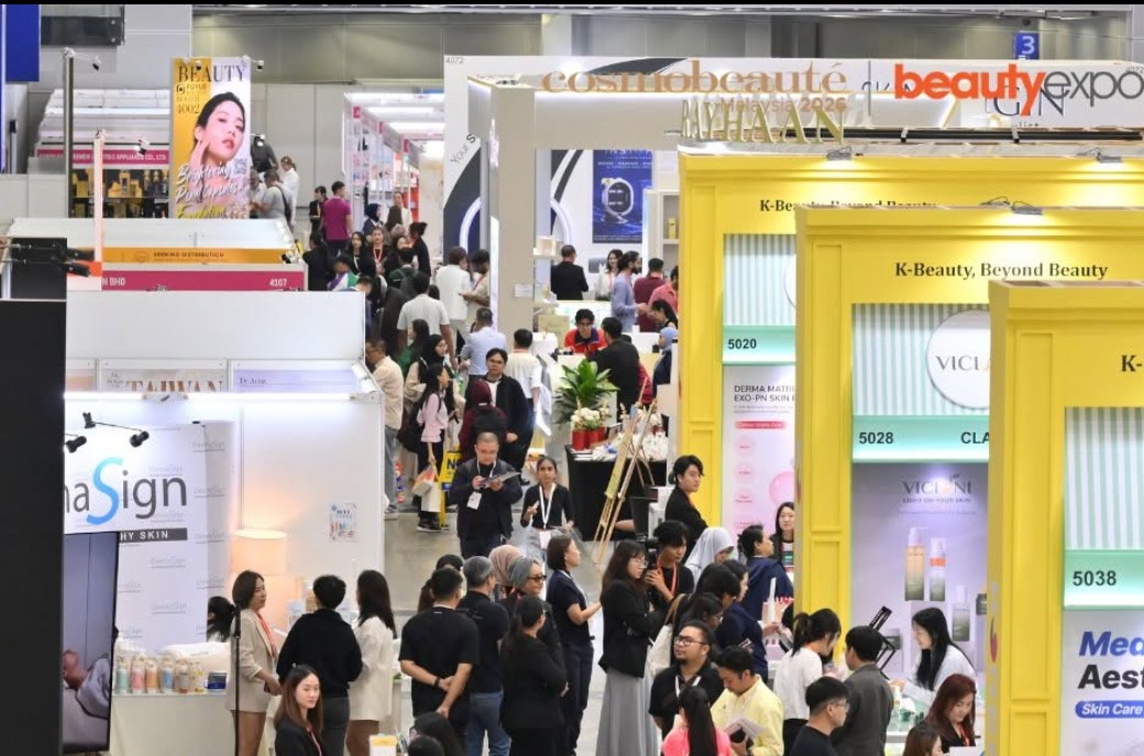 Aisle view of the show floor at Cosmobeaute Malaysia and beautyexpo 2026, KLCC, with Korea pavilion booths in the foreground